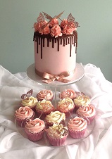 pink Drip cake with cupcakes